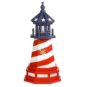 Patriotic spiral striped garden lighthouse in red and white with a blue star topped lantern room and gold eagle medallion