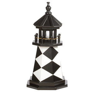 Black and white diamond patterned poly lawn lighthouse with black lantern room, chain railing and hexagonal base
