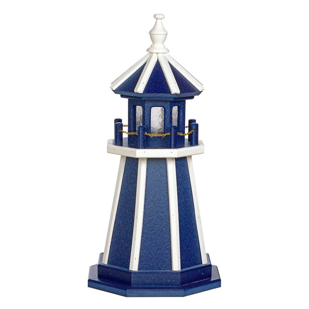 Blue wooden lawn lighthouse with white corner stripes and railing, blue lantern room and white turned finial