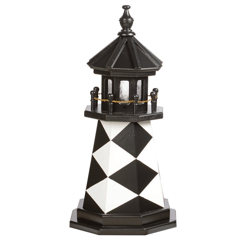 Black and white diamond patterned wooden garden lighthouse with black lantern room, chain railing and matching base