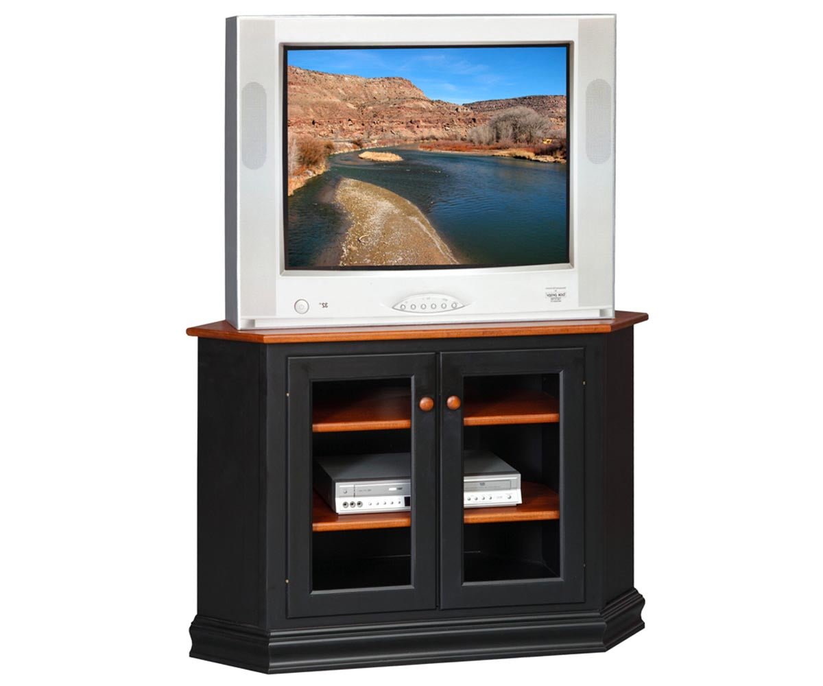 Corner TV stand in black with a cherry top, two glass doors, wood shelves and DVD players inside