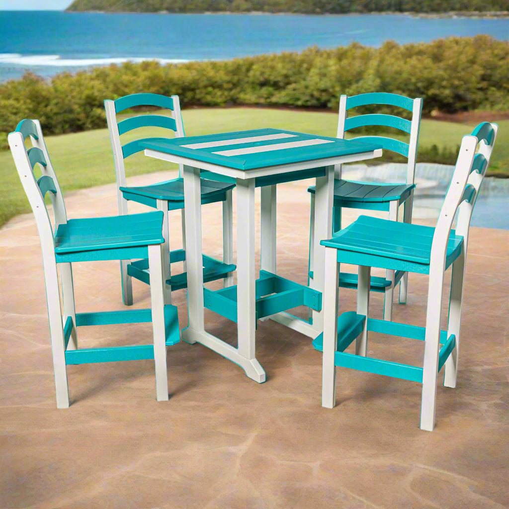 Turquoise and white poly bar table set with four ladderback bar stools on a stone patio overlooking the ocean