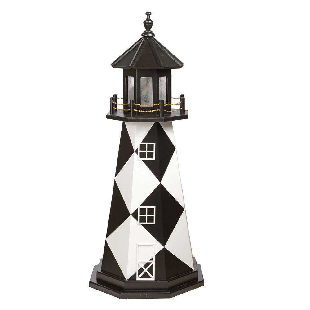 Black and white diamond patterned lighthouse with white window frames, black lantern room and gold chain railing