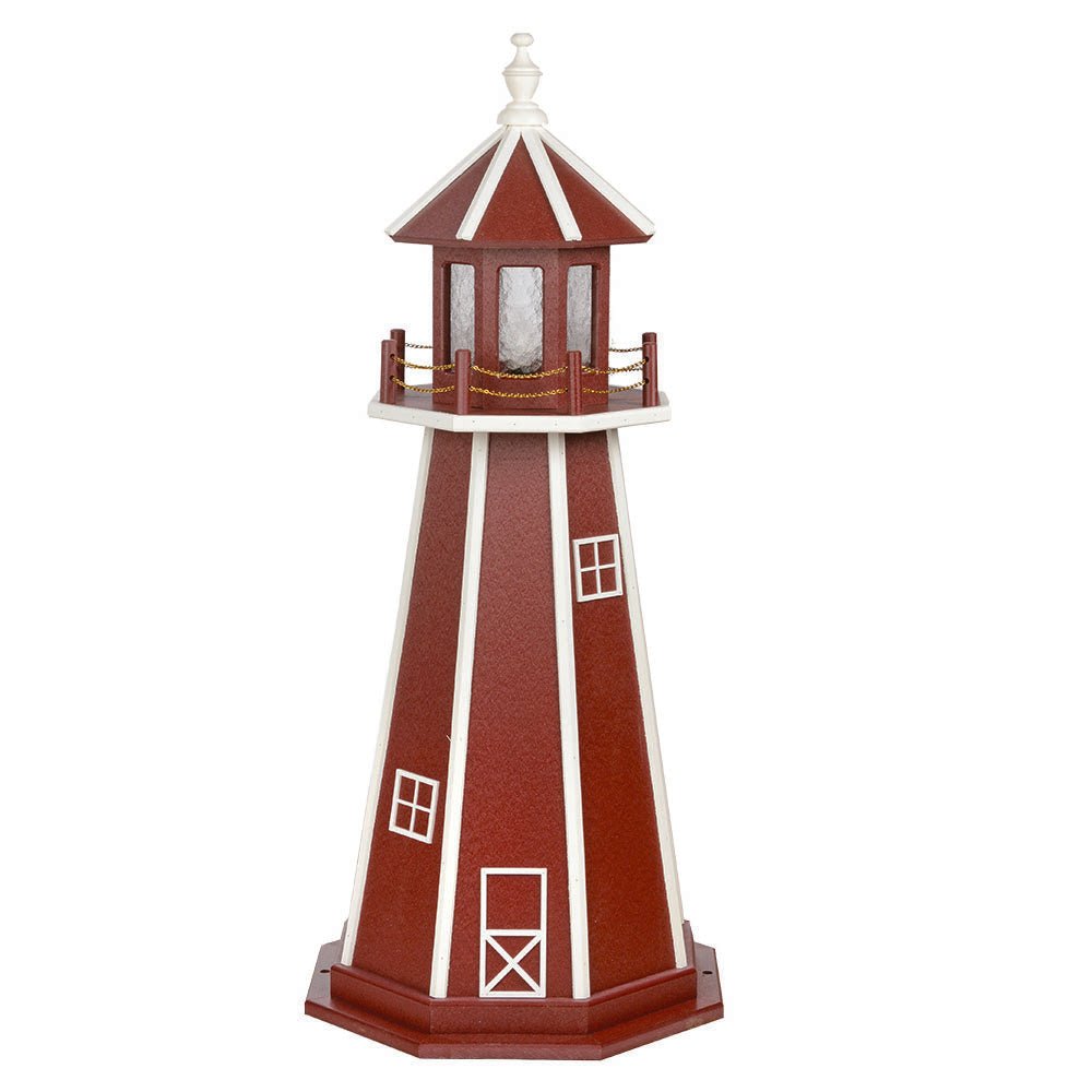 Cherry red lighthouse with white corner stripes, white window frames and door, red lantern room and white railing