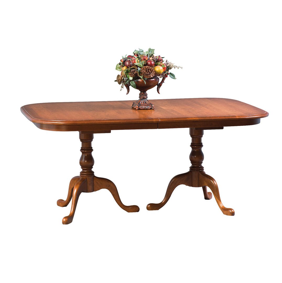 Queen Anne double pedestal dining table in cherry with a leaf seam, rounded corners and cabriole pad feet
