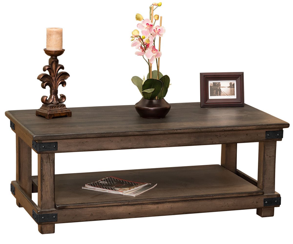 Wooden coffee table with decorative items on a white background