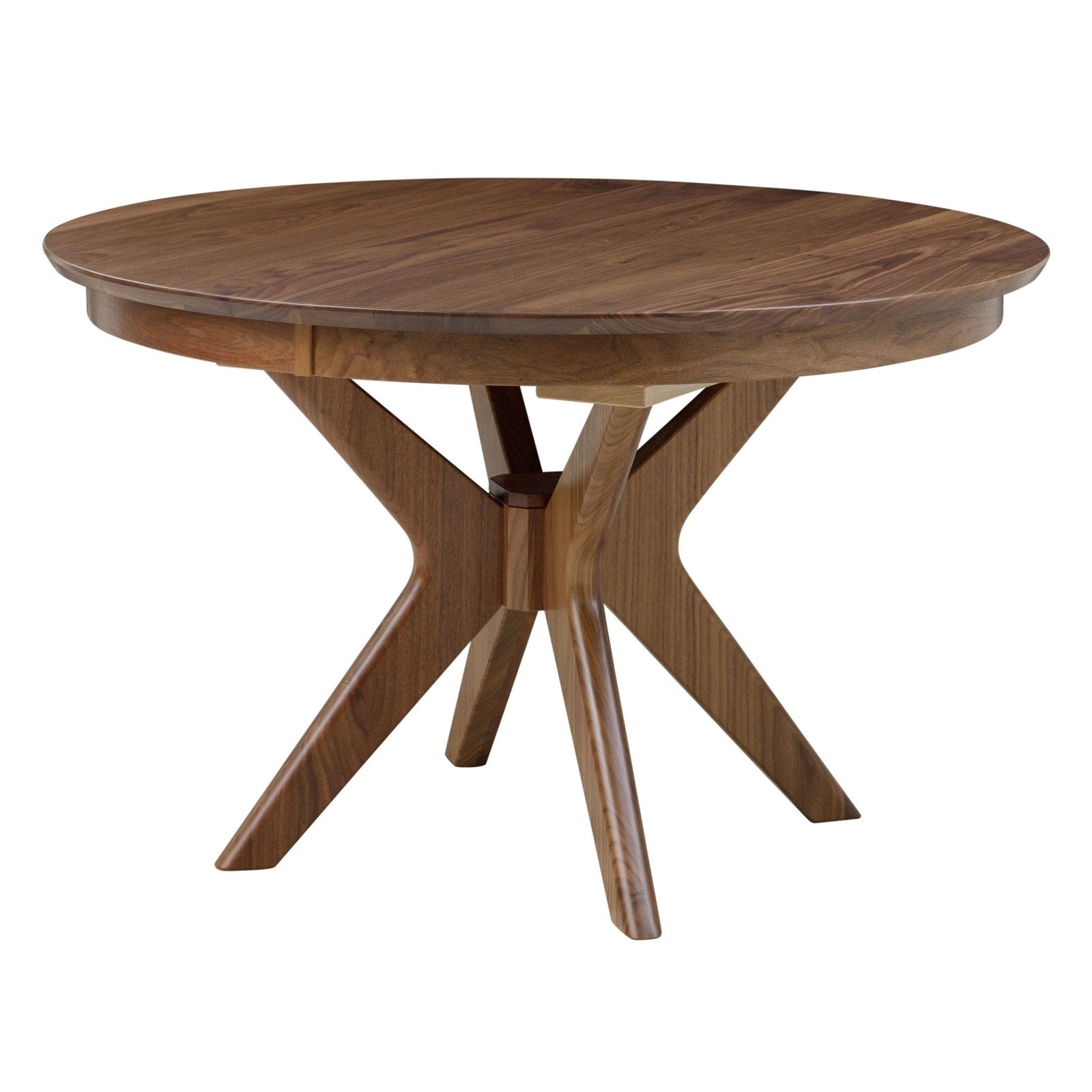 Round walnut mid century dining table with a crossed pedestal base and four seafoam upholstered chairs in a coastal dining room