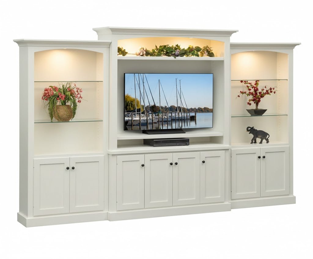 White painted entertainment wall unit with lighted side towers, glass shelves, arched TV alcove and Shaker doors below