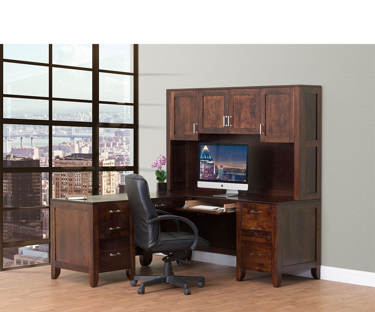 Cherry L desk paired with a four door hutch over the monitor and two three drawer pedestals in a modern office