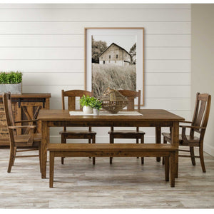 Rustic solid oak dining set with 72 inch shaker-leg farmhouse table, four slat-back chairs and matching bench against a shiplap wall