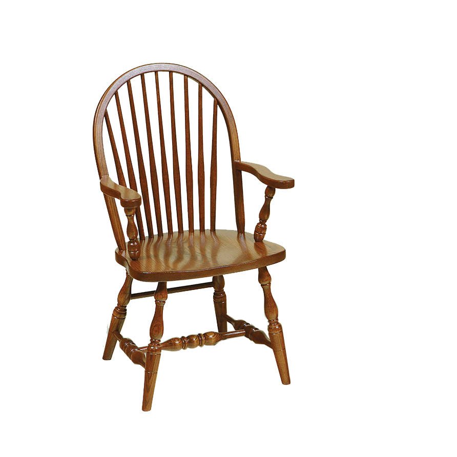 Oak Windsor arm chair with nine back spindles, shaped flat arms on turned posts and a contoured saddle seat