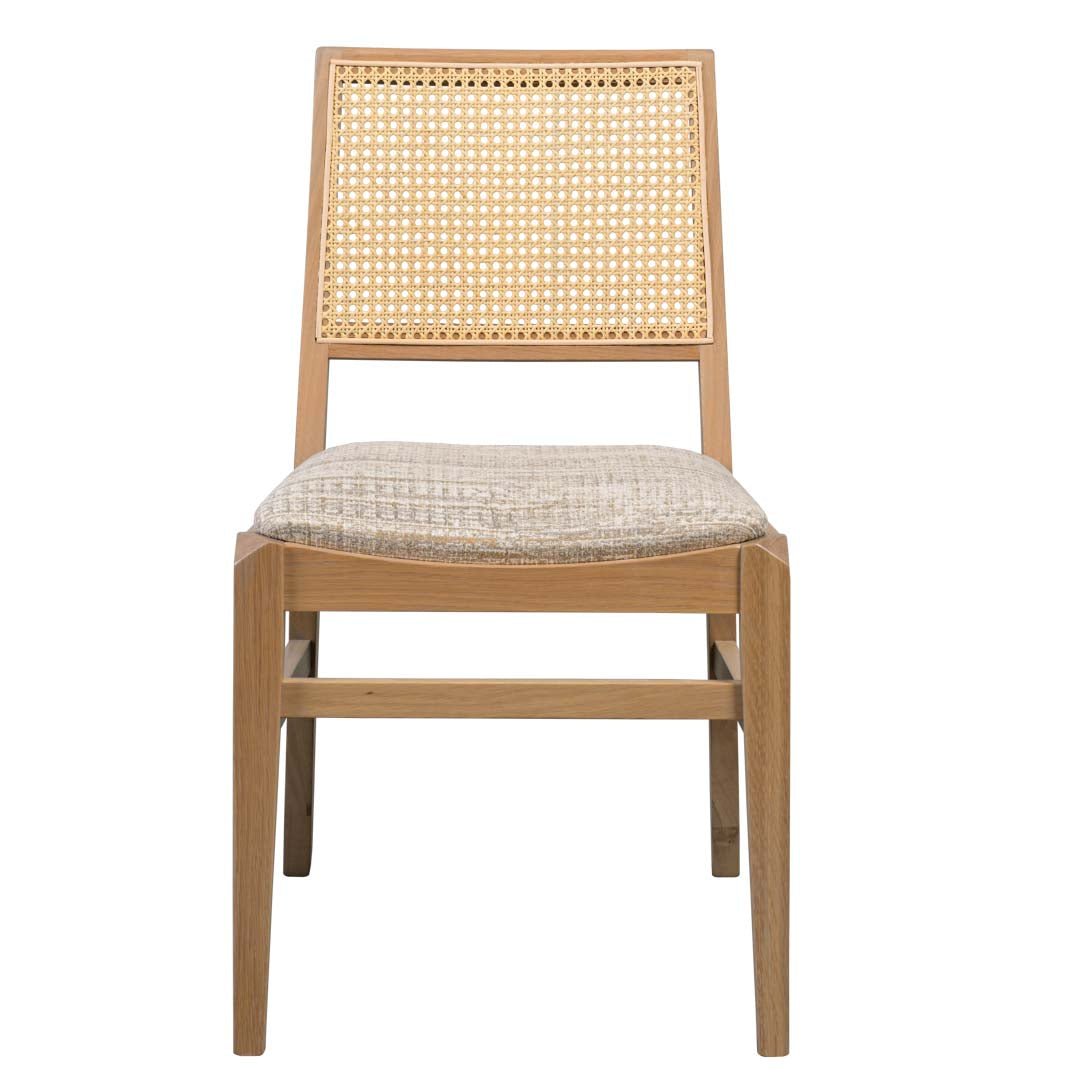Front view of the cane back dining chair with oatmeal woven seat and slim light oak frame