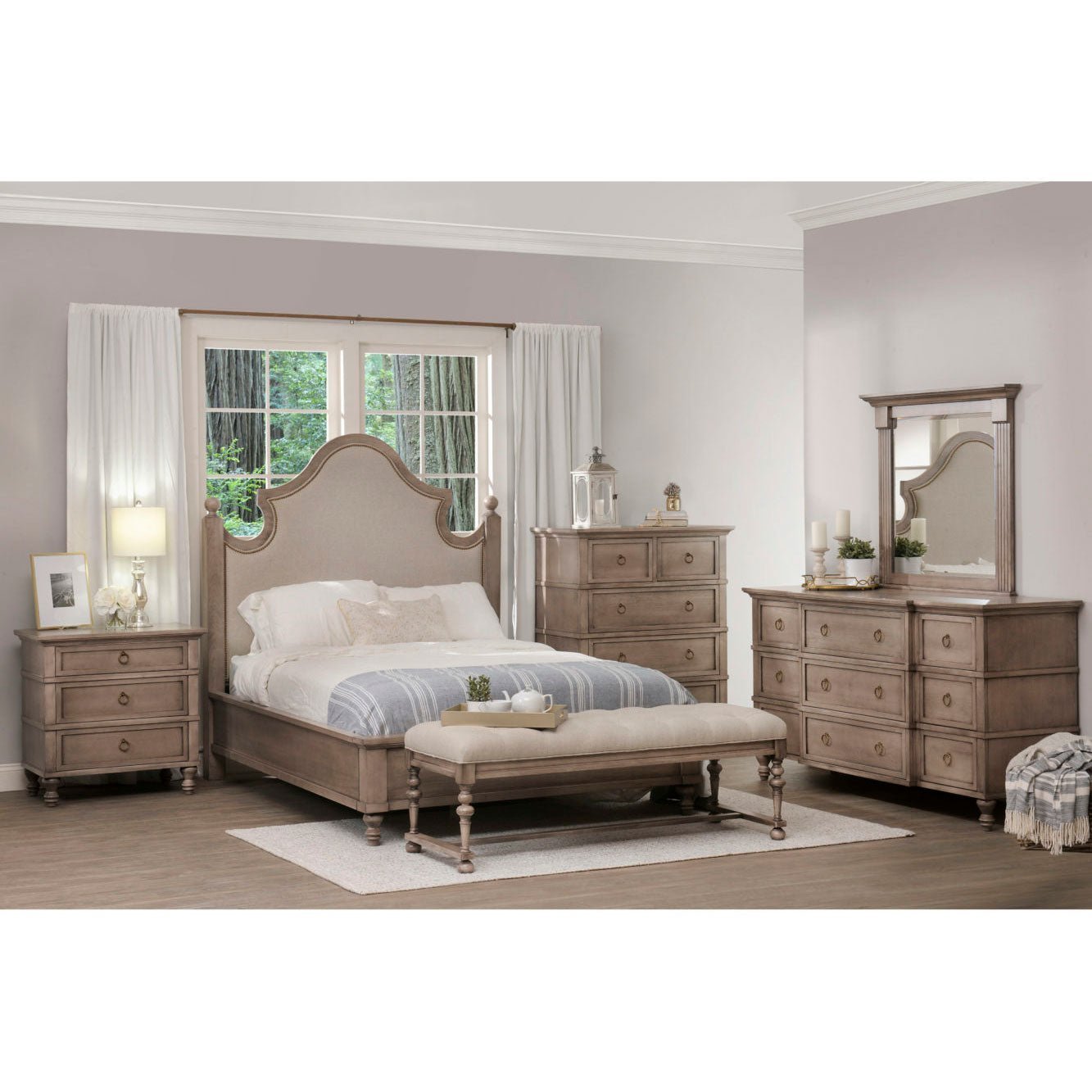 Six piece bedroom set with arched upholstered bed, nightstand, chest, dresser with mirror and bench in weathered driftwood