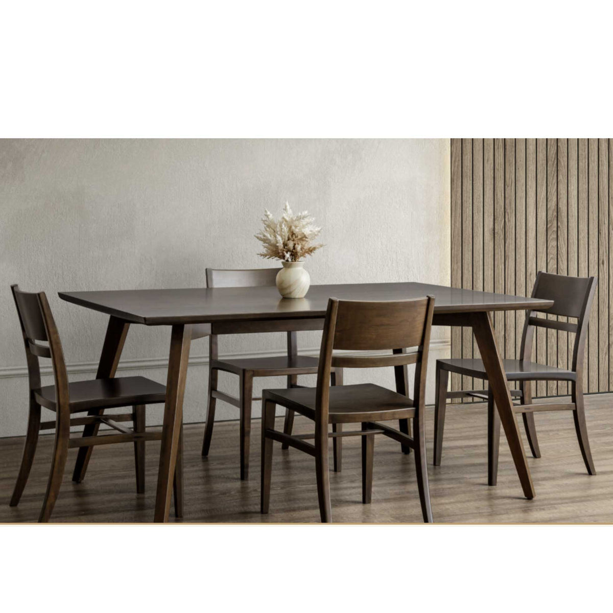 Dark walnut Astoria rectangle dining table with angled tapered legs and four matching chairs in a modern room