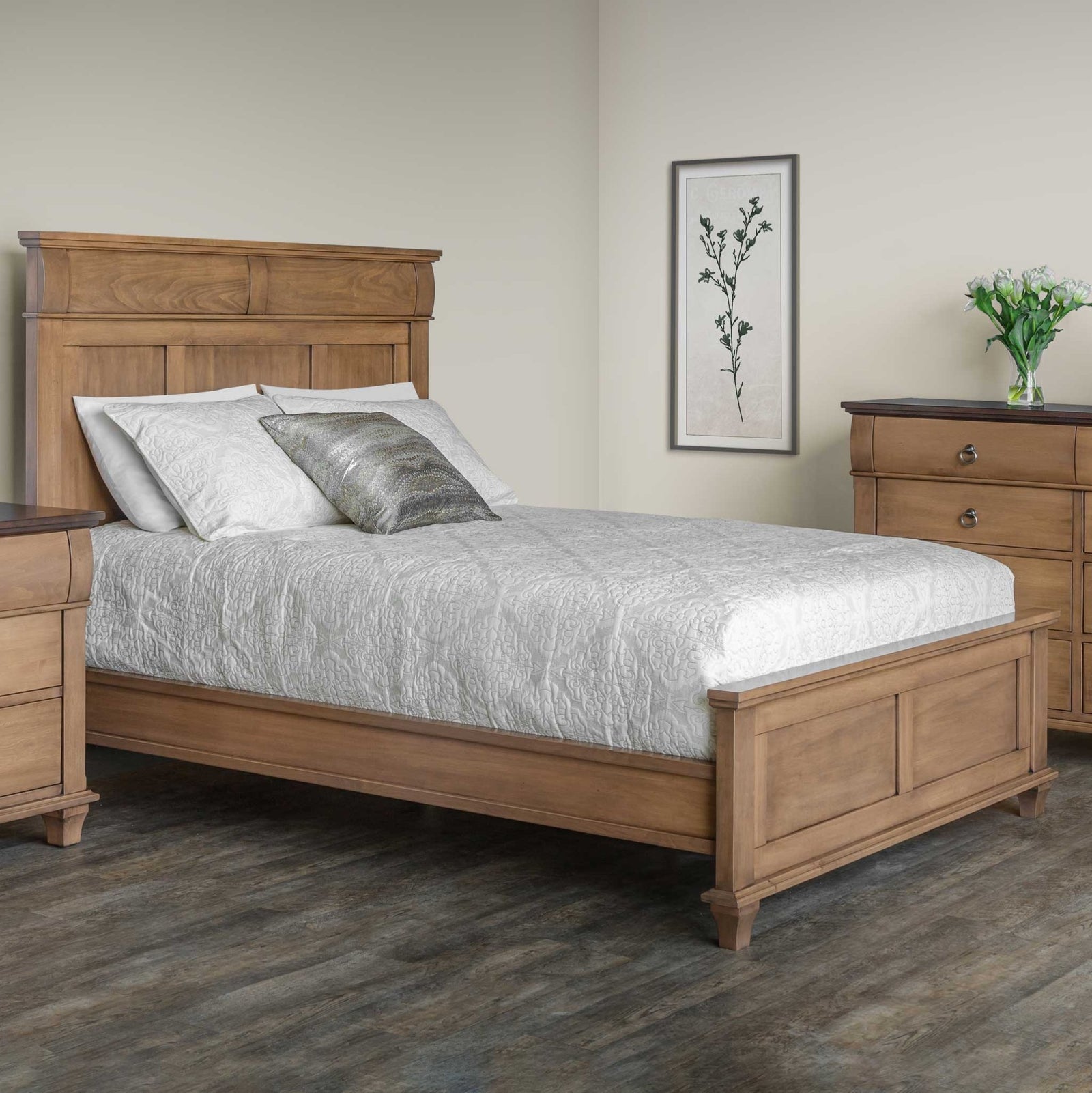 Light almond panel bed with a tall paneled headboard styled with white bedding beside a nightstand and chest