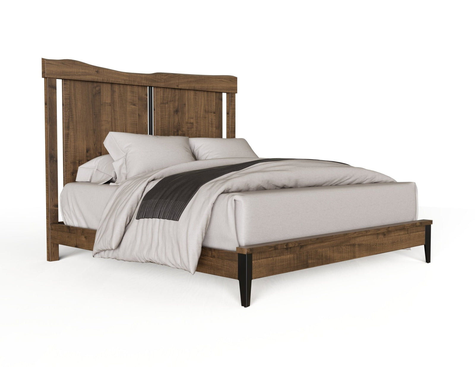 Rustic reclaimed wood bed with a tall planked headboard, low footboard rail and dark tapered legs in a wood-paneled bedroom