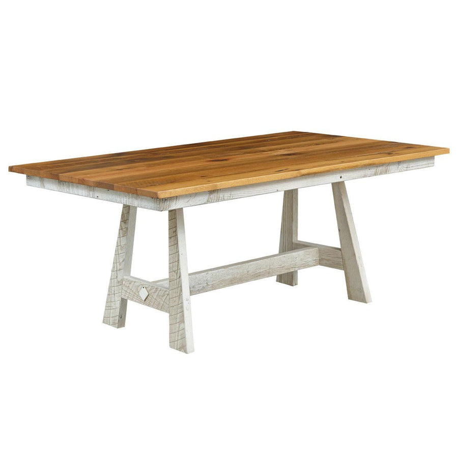 Reclaimed wood trestle dining table with a natural stained plank top and distressed white A frame base