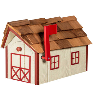 Cream barn-style wooden mailbox with red trim, cedar shake roof, arched X-braced doors and red flag