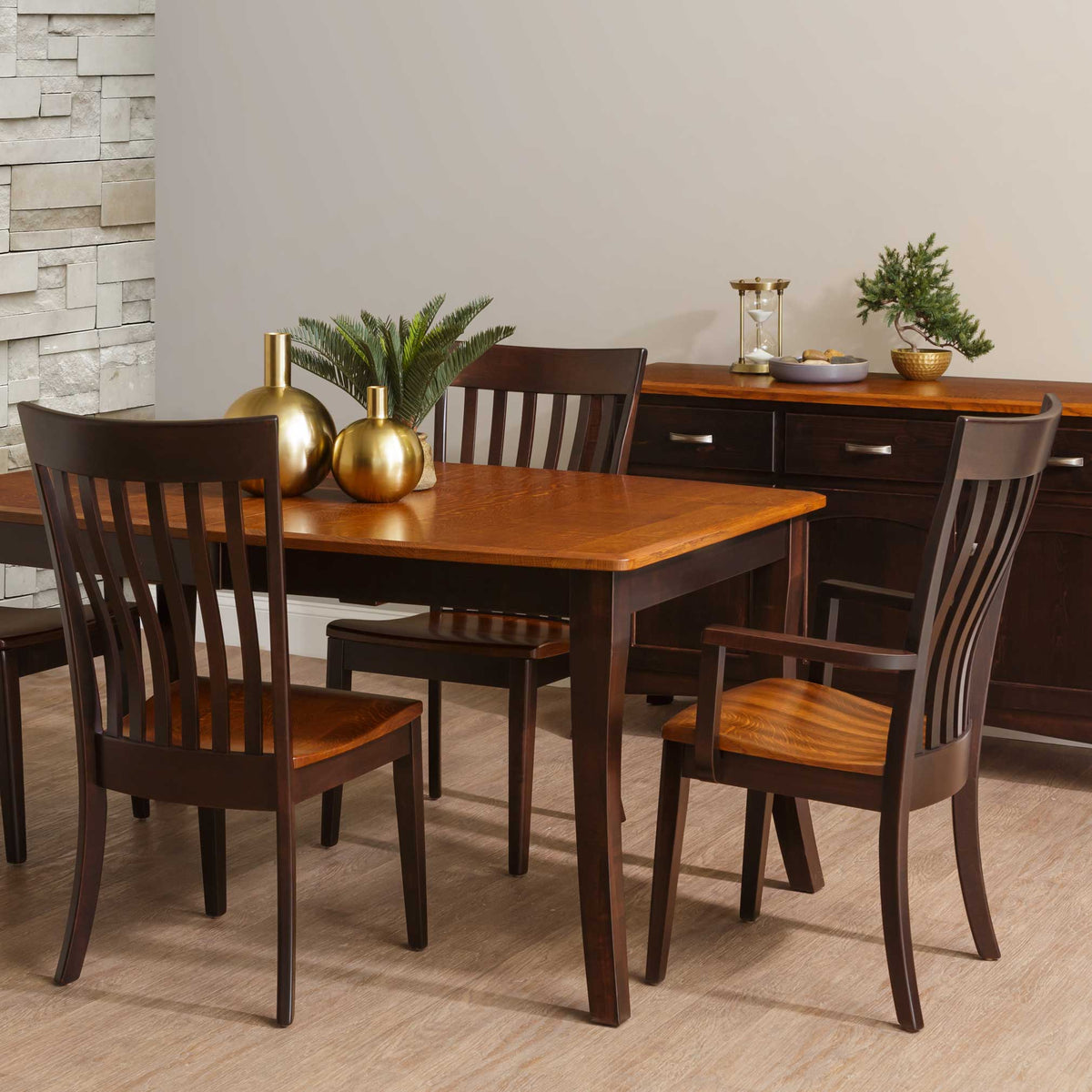 Two-tone dining chairs with dark espresso frames and natural oak seats at a table with a golden oak top