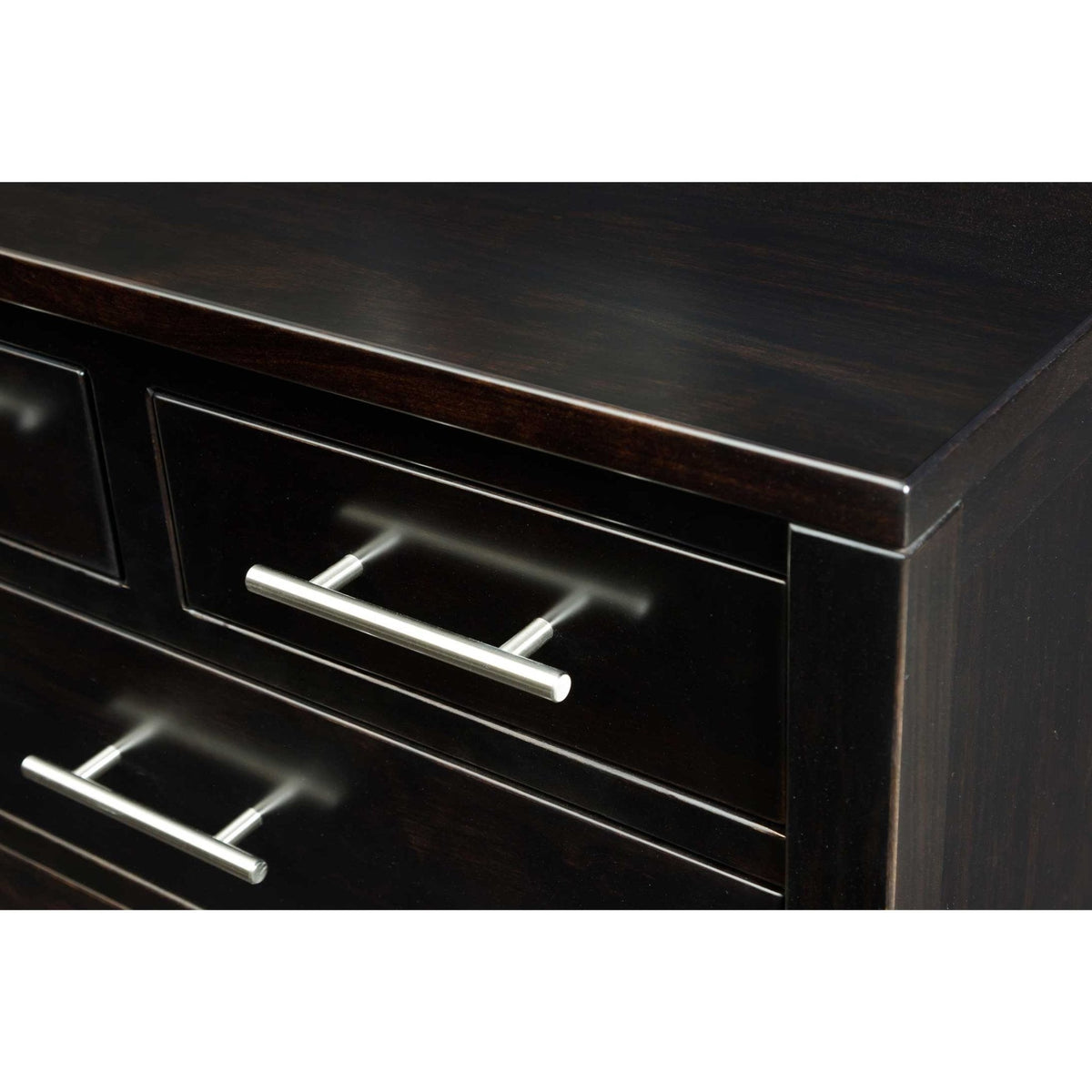 Corner detail of an espresso dresser showing the smooth top edge and slim brushed nickel bar pull handles