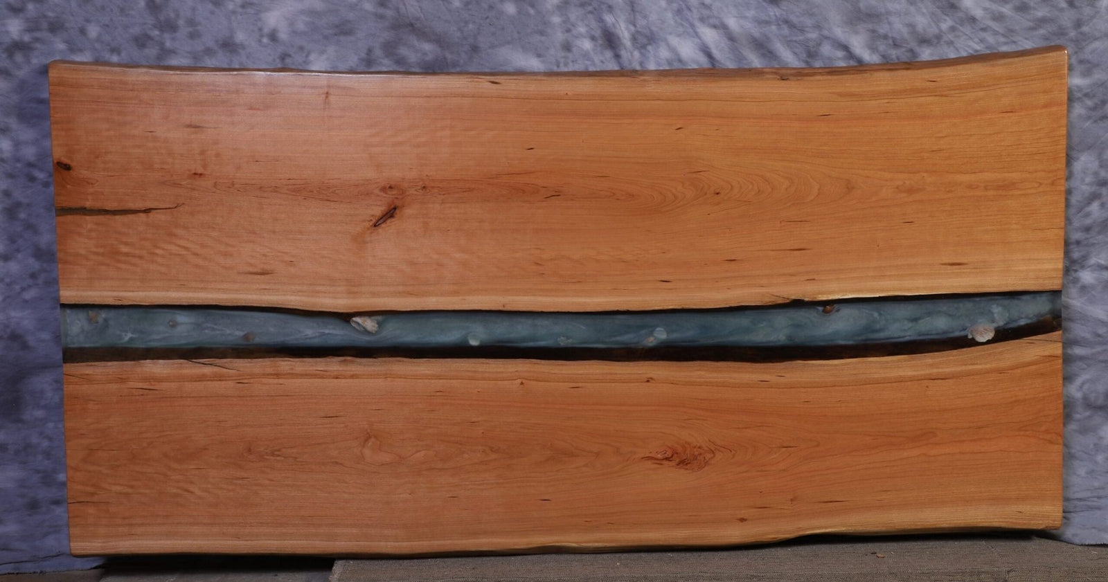 Cherry live edge river slab 84 inches long and about 41 inches wide with a teal resin river between two halves