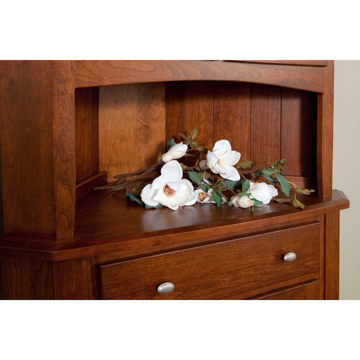 Detail of the corner hutch open shelf area with beadboard back panel and drawer with a nickel knob below