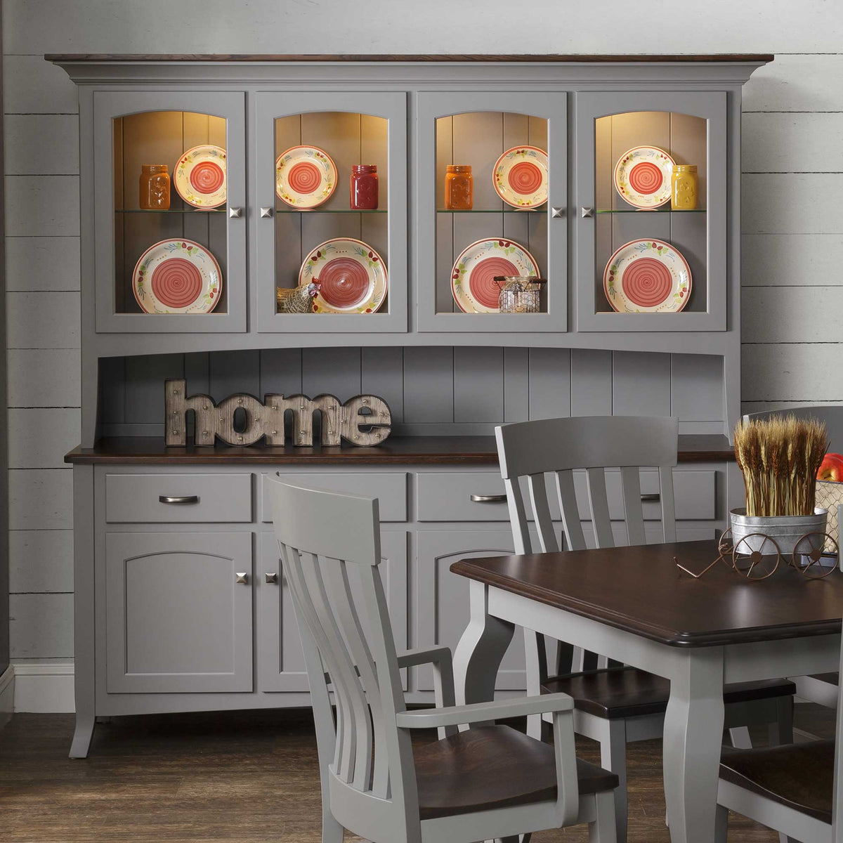 Gray painted china hutch with a walnut top, four lighted glass doors, plate display and beadboard back