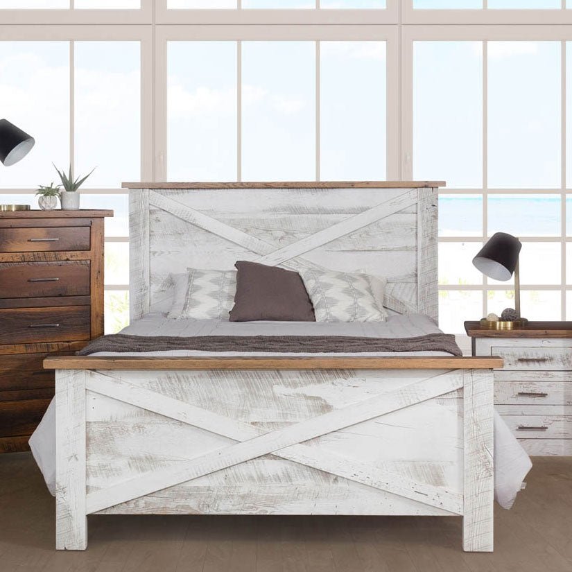 Distressed white barn door style panel bed with X plank headboard and footboard capped in natural wood