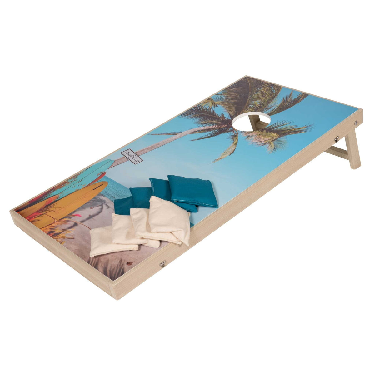 Palm tree and surfboard cornhole board with teal and cream bean bags, folding legs and light wood frame