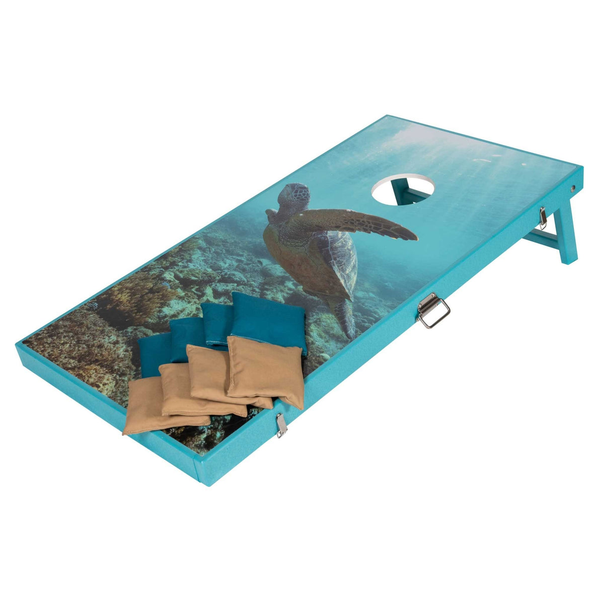 Teal framed cornhole board printed with a sea turtle over coral reef, teal and tan bean bags on the surface