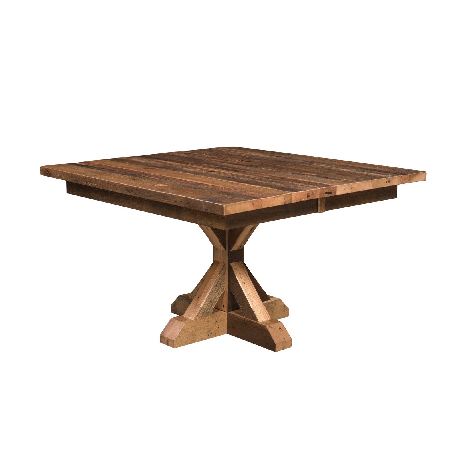 Extendable reclaimed wood table on a heavy X pedestal, set with plates and greenery beside four ladder chairs and brick wall