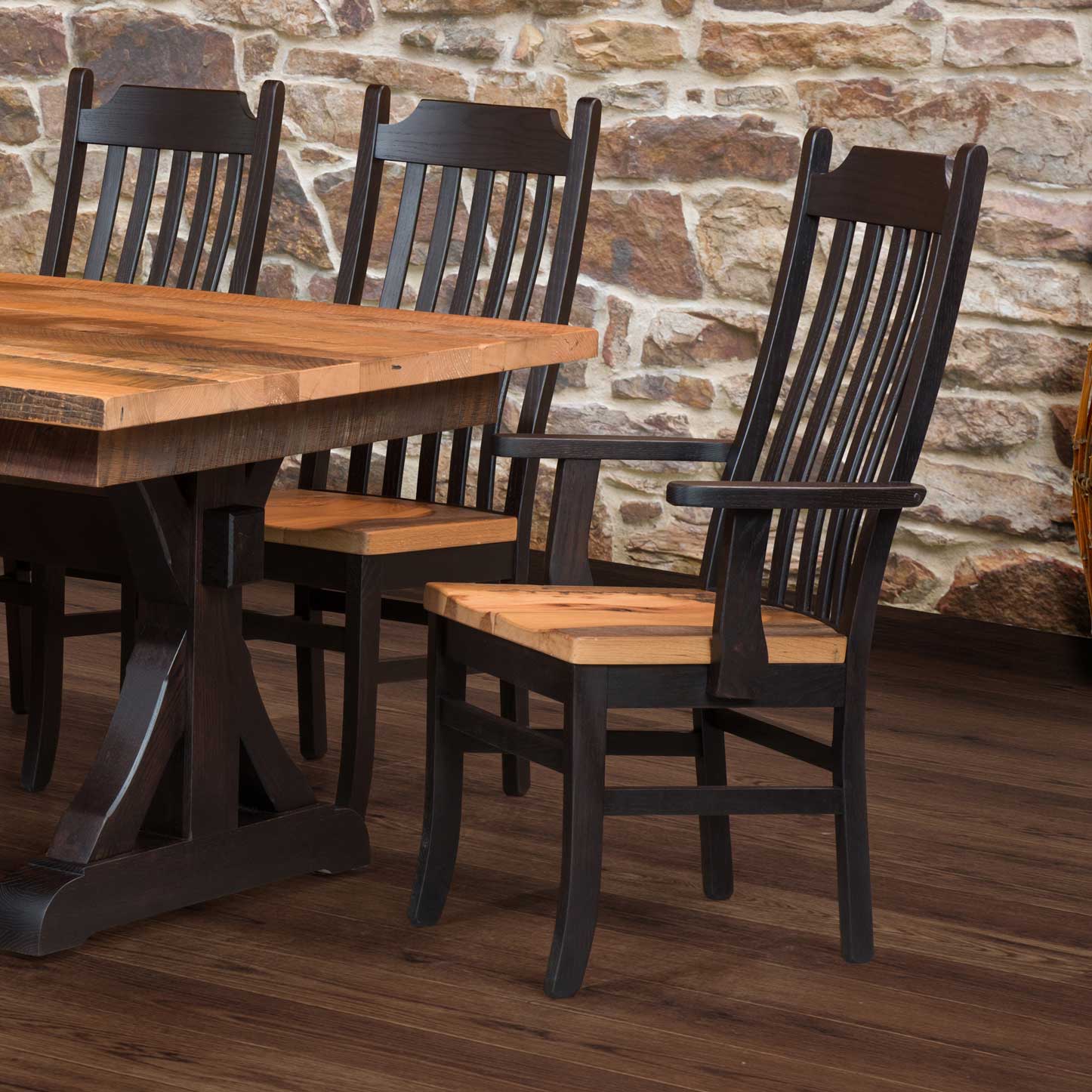 Mission style dining chair with a black painted frame, seven curved vertical back slats and a natural reclaimed wood saddle seat