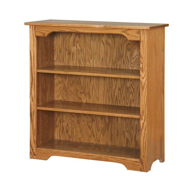 Medium oak bookcase with two adjustable shelves, arched apron detail and curved feet on white