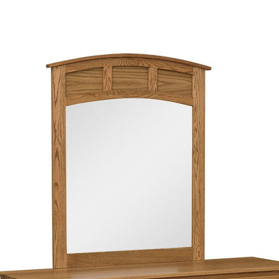 Curved panel dresser mirror in oak with an arched top rail and three small raised panel accents