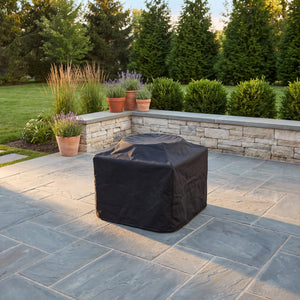 Fernandina poly fire table cover, black, on stone patio