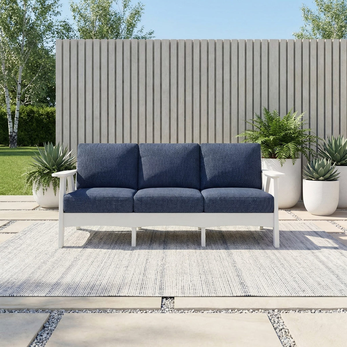 Fernandina poly cushion sofa, light gray with navy cushions, modern patio