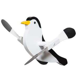 White and black wooden chickadee whirlybird wind spinner with yellow beak, black cap and paddle wing blades