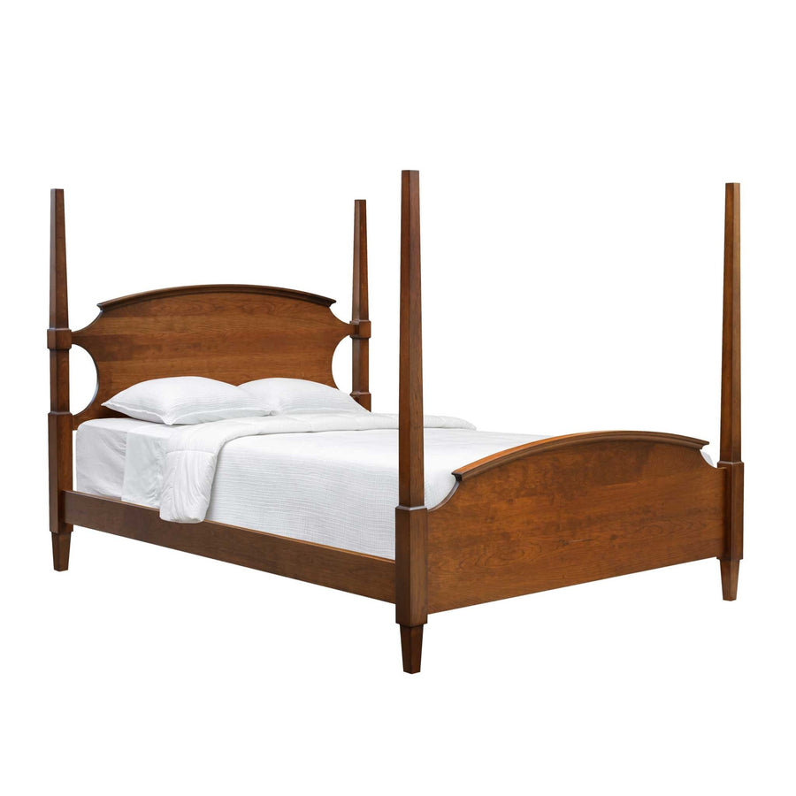 Cherry four poster bed with a curved headboard, arched footboard and tall square tapered posts on white