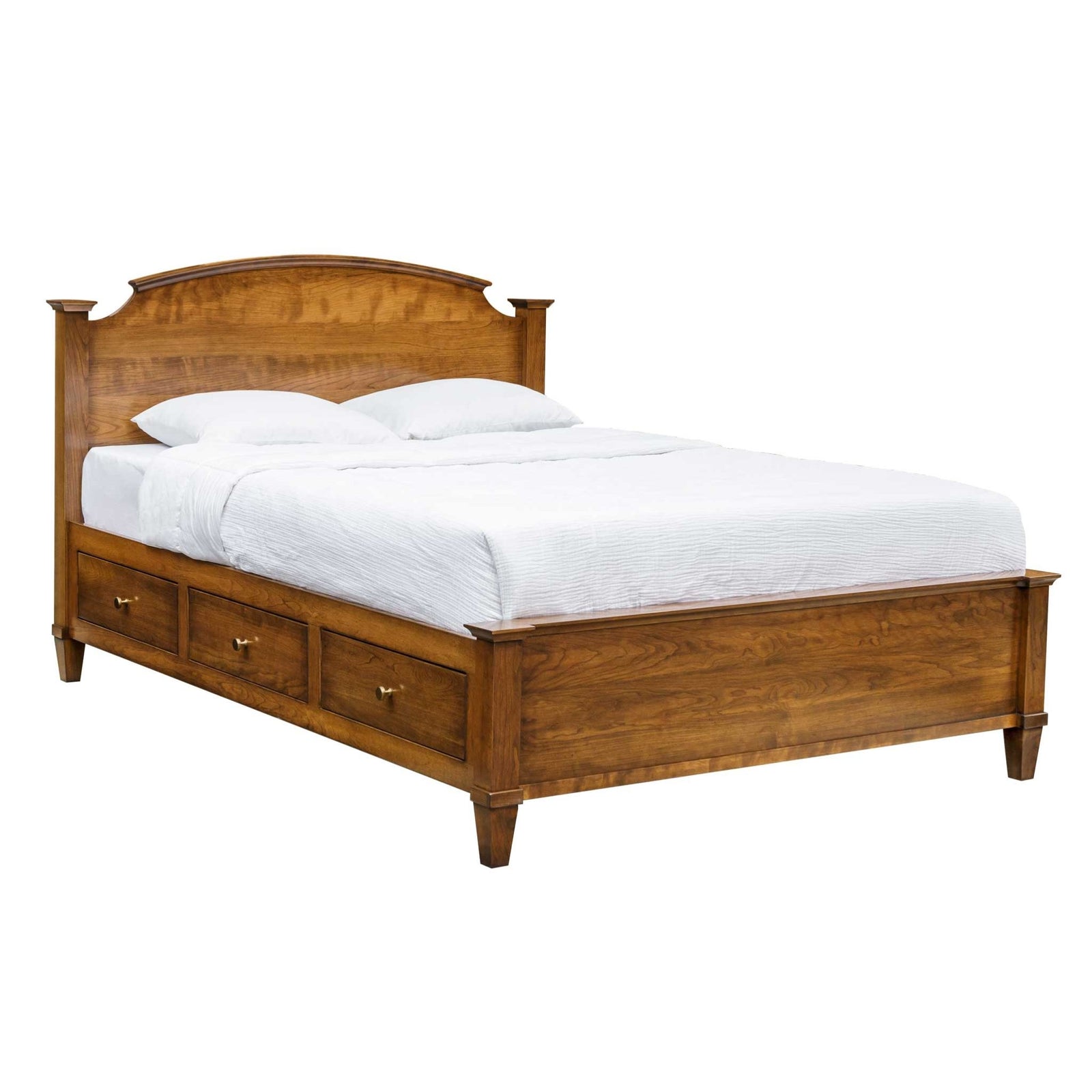 Cherry storage platform bed with arched headboard and three footboard drawers, styled with a matching three-drawer nightstand and brass knobs