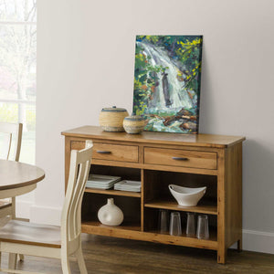 Honey oak 50 inch open buffet with two drawers, four open shelf compartments and dishes on display
