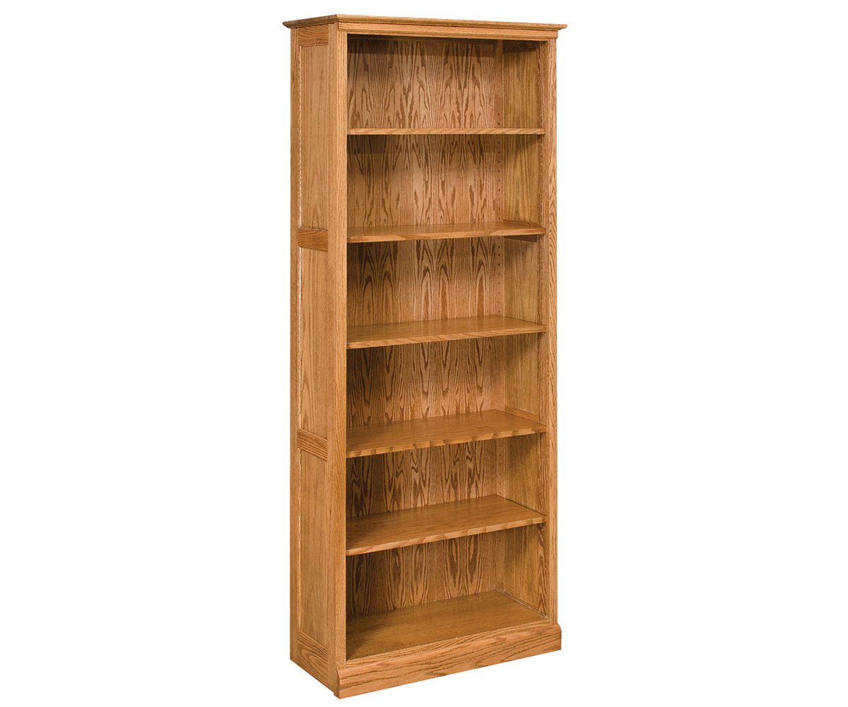Tall six-shelf oak bookcase with adjustable shelves, crown-style top molding and paneled sides on a white background