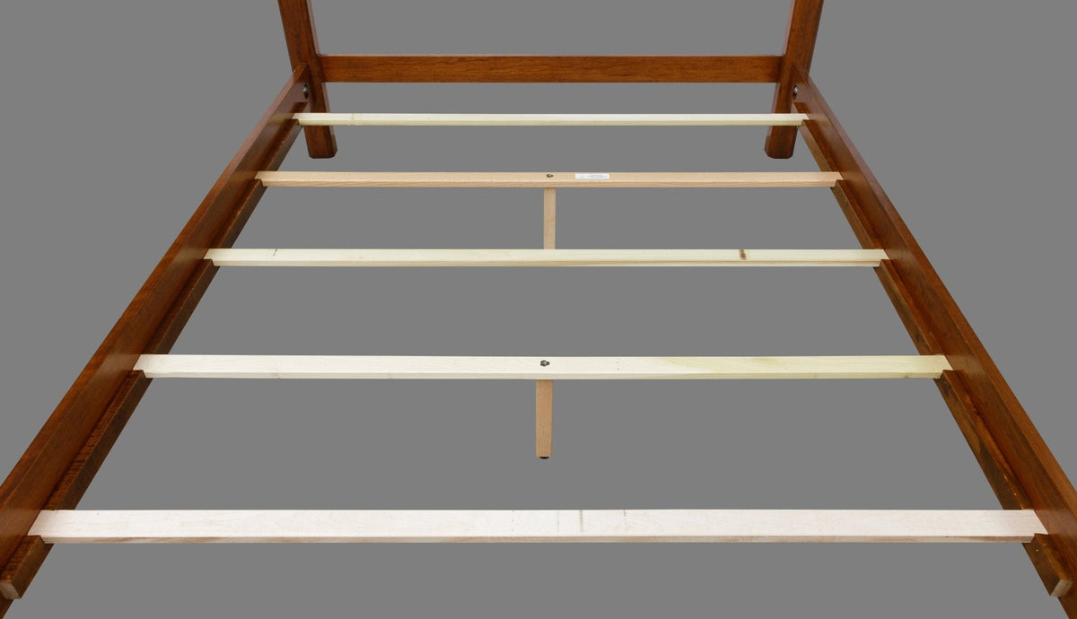Poster bed frame shown from the foot with cherry rails, maple slats and two center support legs on gray