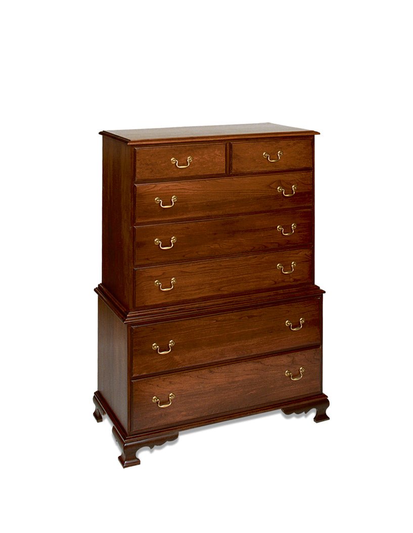 Tall cherry chest on chest with stacked drawer sections, brass bail pulls and a scalloped ogee bracket foot base