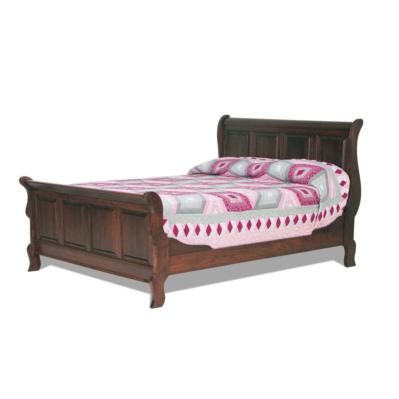 Dark cherry sleigh bed with paneled scroll headboard and footboard beside a four-drawer nightstand and pink quilt
