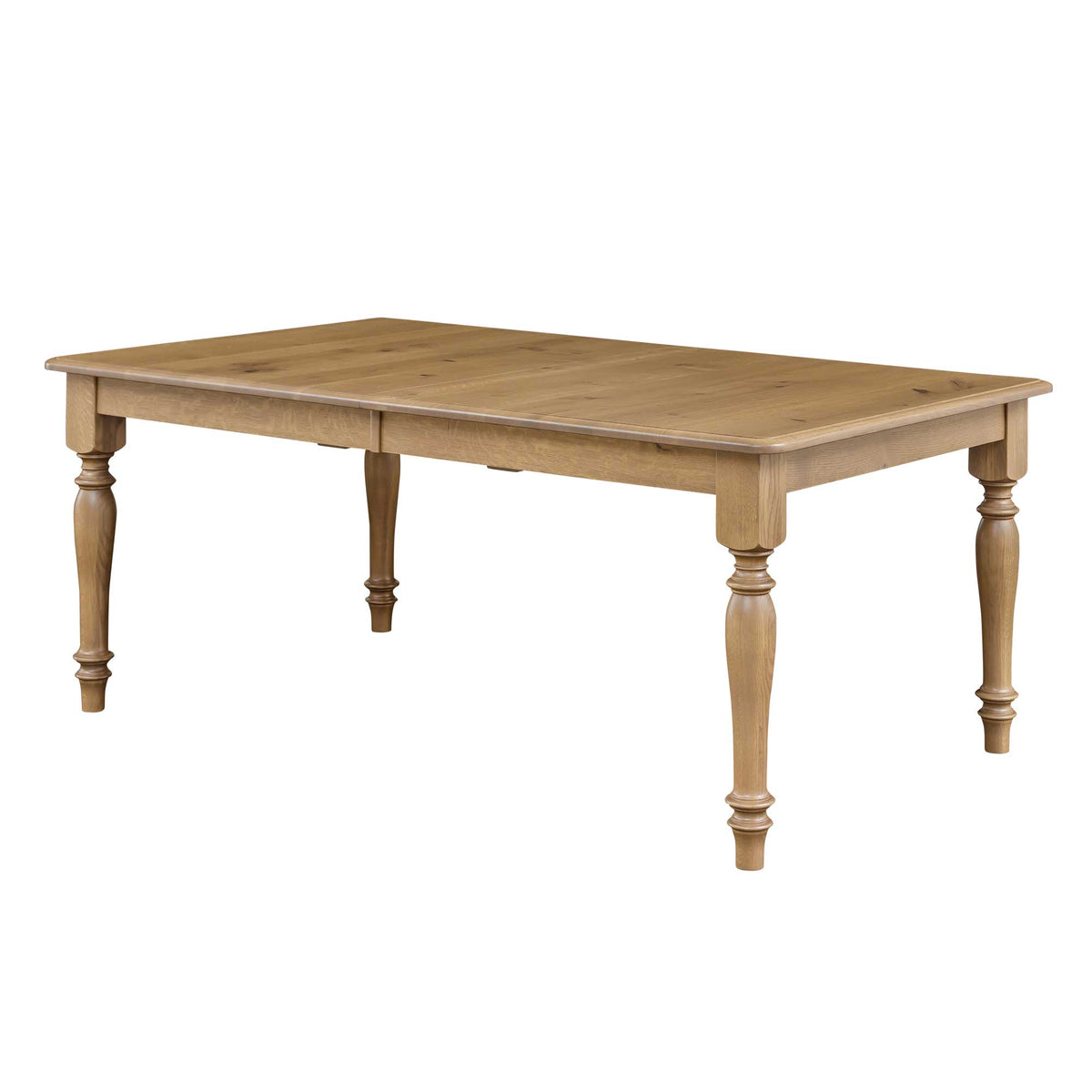 Rectangular solid oak farmhouse dining table with chunky turned legs in a light natural finish, shown with the extendable leaf seam visible