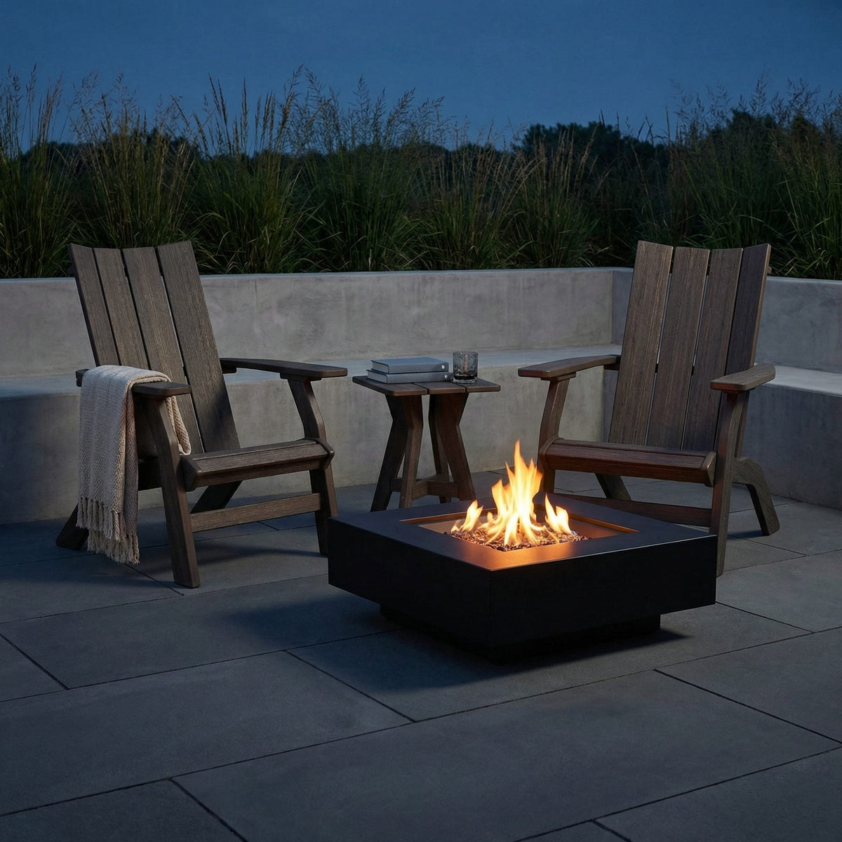 Kent Island poly Grandpa (raised) Adirondack chairs with end table, coastal gray, fire table at dusk - lifestyle (other pieces sold separately)