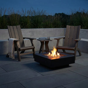 Kent Island poly Grandpa (raised) Adirondack chairs with end table, coastal gray, fire table at dusk - lifestyle (other pieces sold separately)