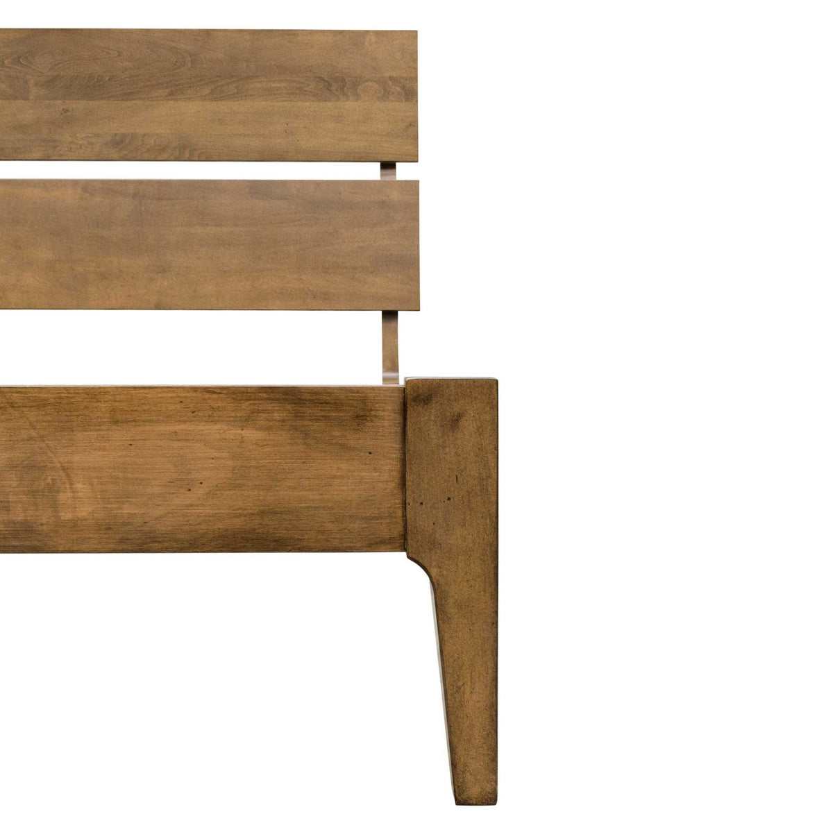 Close view of the angled two-plank headboard meeting the low side rail and flared tapered leg