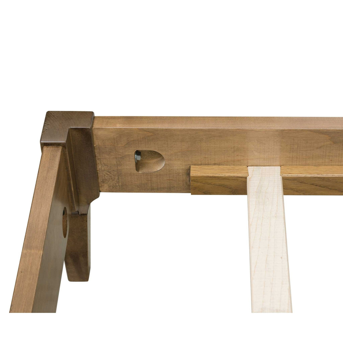 Bed rail hardware detail showing the recessed bolt, mortised bracket and maple slat on the light wood frame