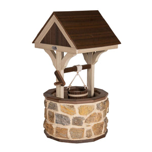 Stone wishing well with a brown gabled roof, tan trim, rope-hung wooden bucket and crank arm on a white background